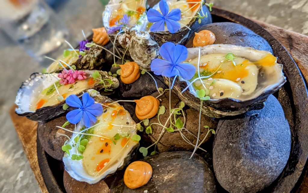 Raw Oysters served on cold river stones at Quercus Guadalupe Valle