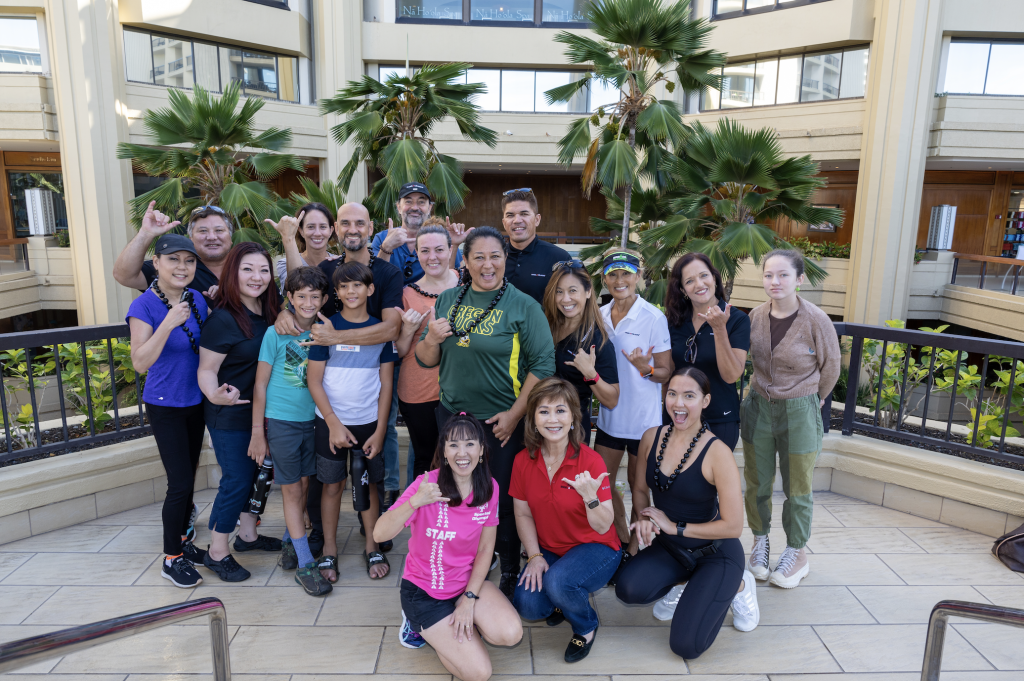 Engel & Völkers real estate advisors on a rooftop in Hawaii after an event for Special Olympics Hawaii