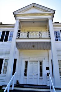 The entrance to historic Wirick-Simmons House - 2 story white building