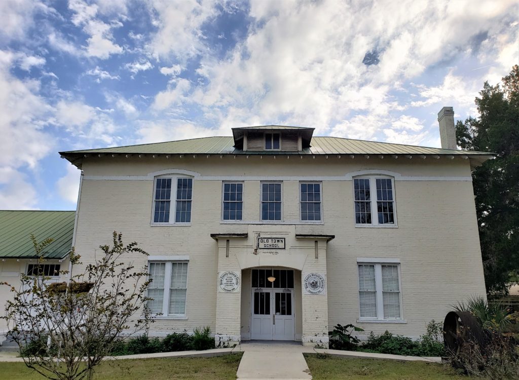 old 2 story cream colored building