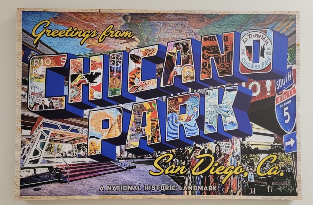 Wall mural painted like a postcard reading "Greetings from Chicano Park San Diego, Co. A National Historic Landmark". Chicano Park murals, Barrio Logan.