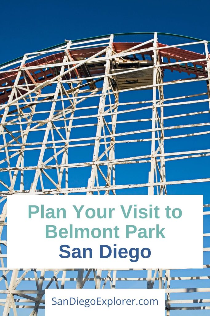 Catch the wave of fun only at Belmont Park San Diego. Step back in time and have an old-fashioned good time with your entire family. bottom up shot of a white wood rollercoaster arch with dark blue sky - text overlay: Plan your visit to Belmont Park San Diego
