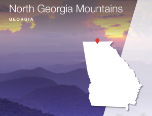 A graphic announcing Engel & Völkers' expansion into the North Georgia Mountains.