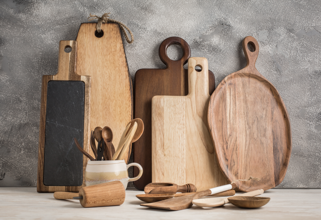 wooden boards and serving utensils on a stone counter