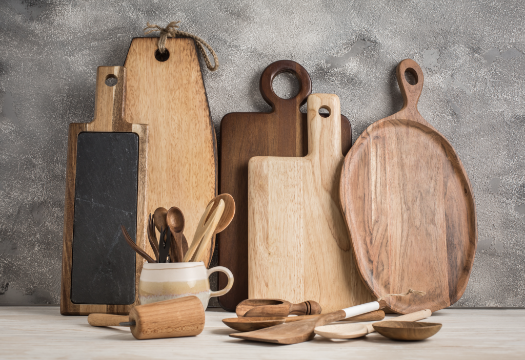 Wooden boards and serving utensils on a stone counter.