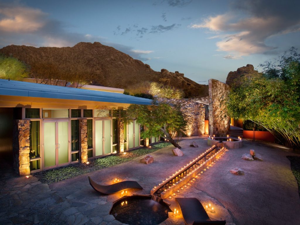 Sunset at Sanctuary on Camelback Mountain Resort & Spa with outdoor area lid up by candels