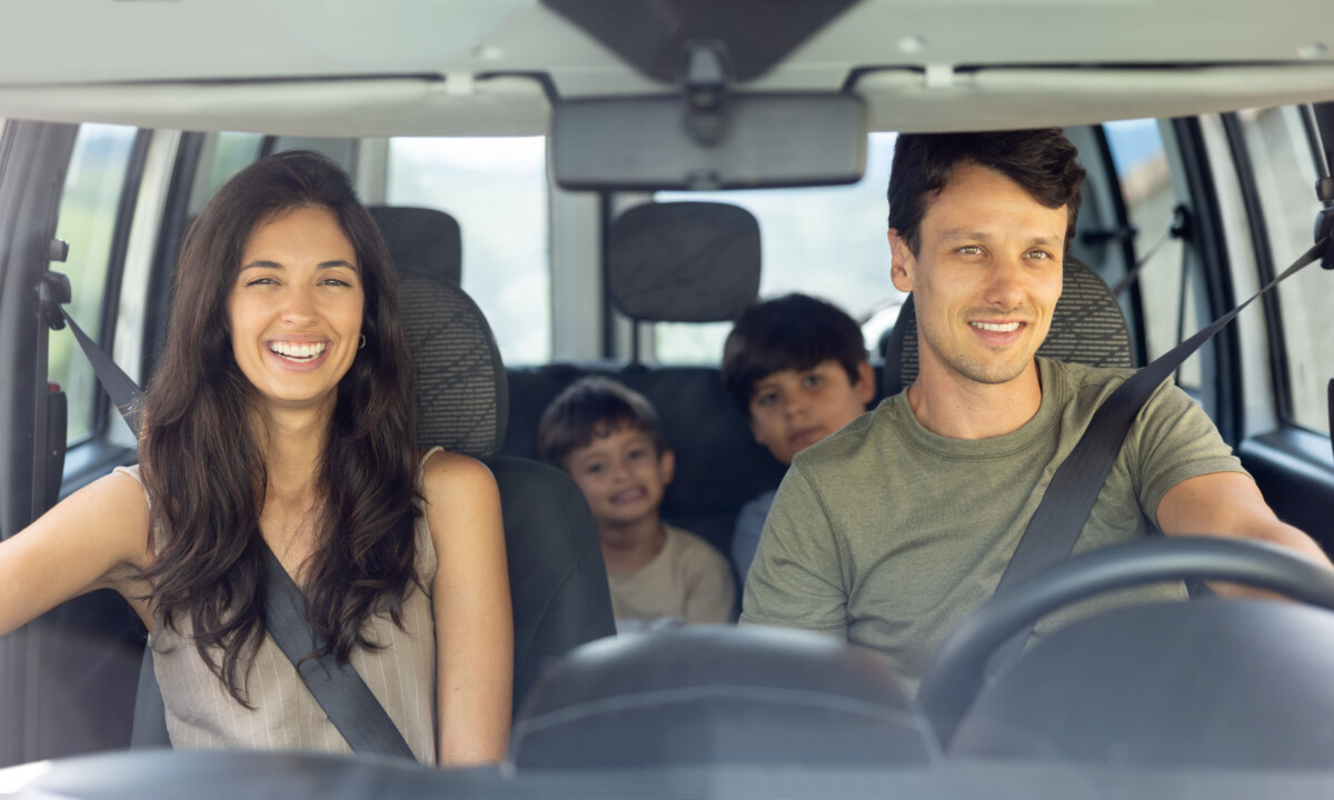 family in a car driving