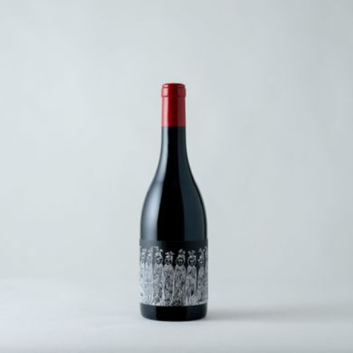 Bottle of fine wine on a monochrome table and background