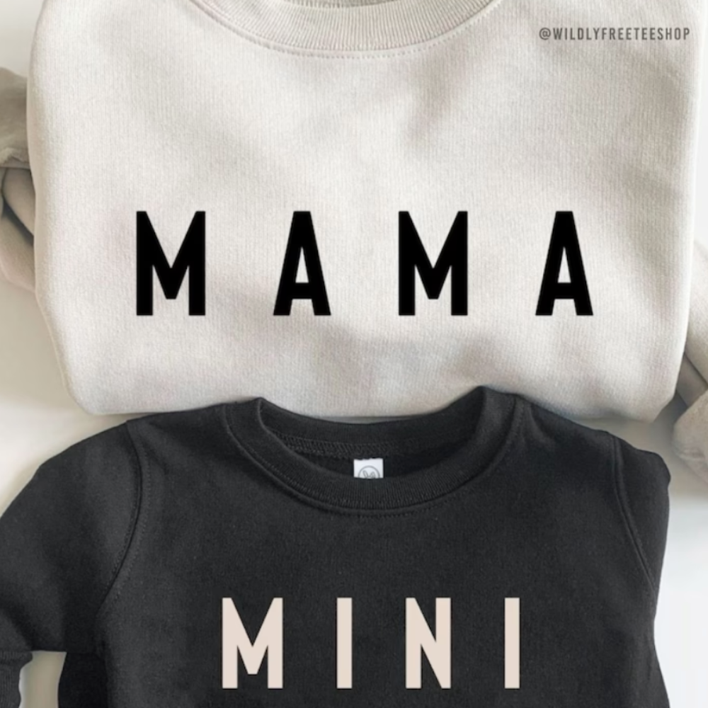 matching mother and child graphic sweaters. 