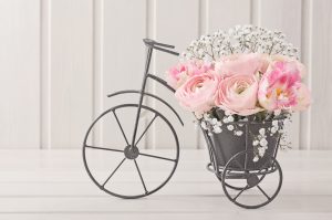 bike with pink flowers in basket