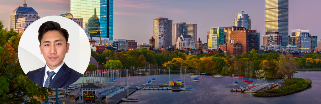 Headshot of Danny Wang over a picture of the Boston riverfront at dusk