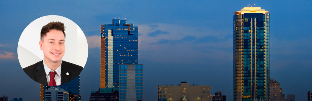 Headshot of Dan Nicoloff over a dusk picture of the Dallas Fort Worth skyline.