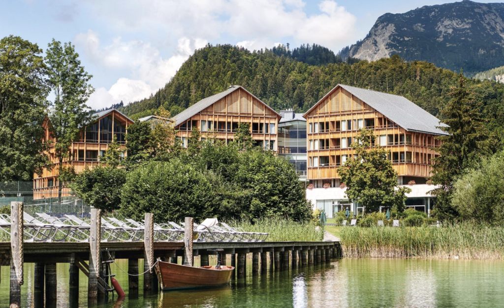 Exterior buildings, dock, and boat of the Mayrlife Health Resrot in Altaussee, Austria.