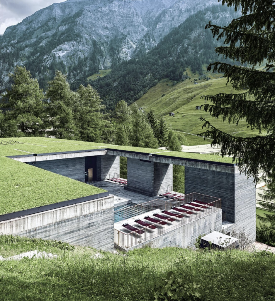 Modern, architectural home with a concrete swimming pool done by architect Peter Zumthor.