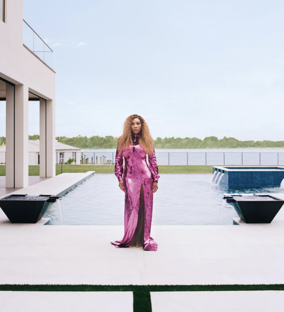 Serena Williams in a glittering pink formal gown, standing in front of the infinity pool of her home in Florida.