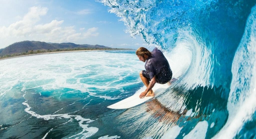 surfer on a surfboard riding a wave