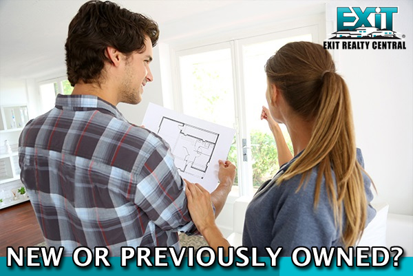 Man and woman looking at a paper deciding new orpreviously owned home in coastal virginia