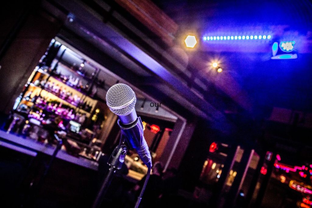 microphone in the foreground. bar in the background