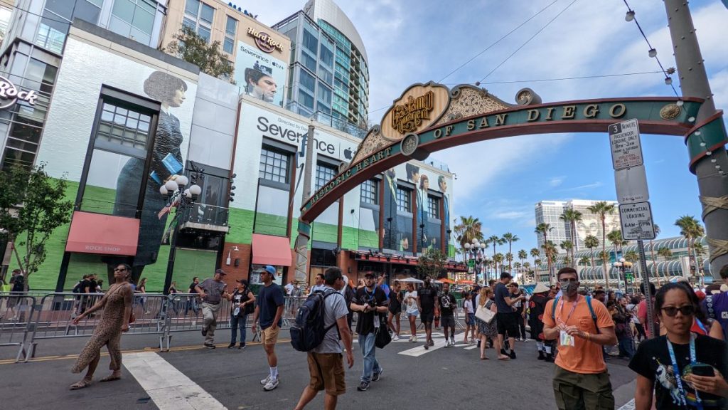 People dressed up in Cosplay during San Diego Comic Con on 5th ave under Gaslamp Quarter sign