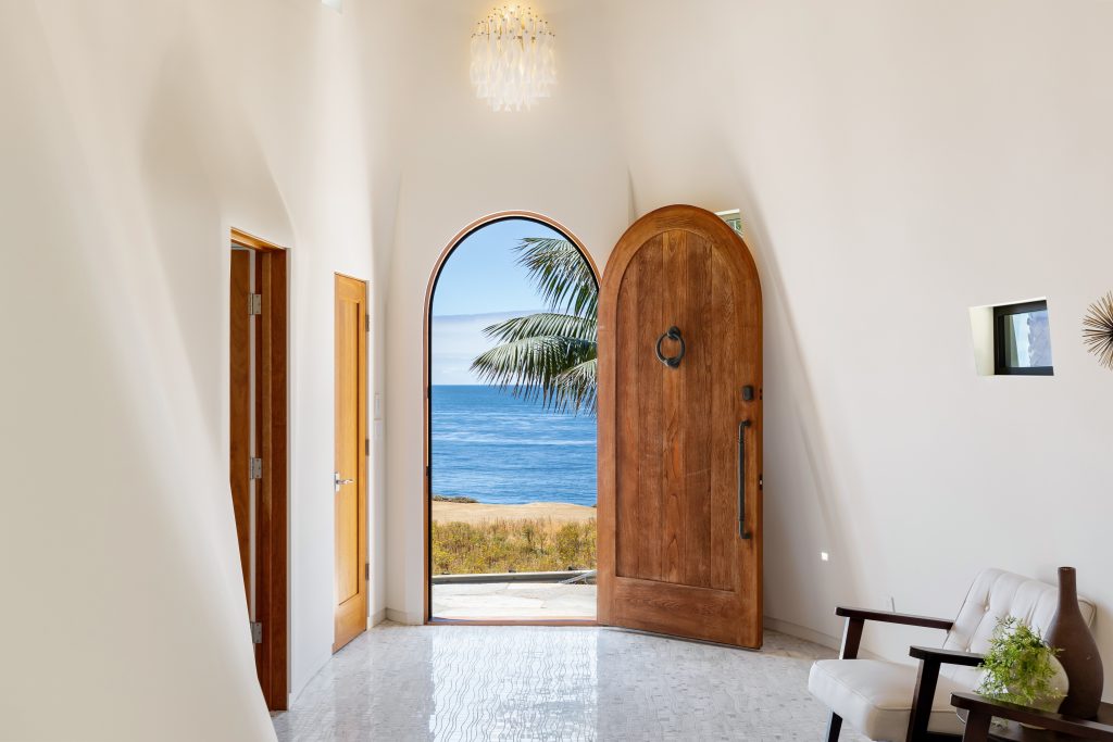 Welcoming entrance with rustic wooden door.