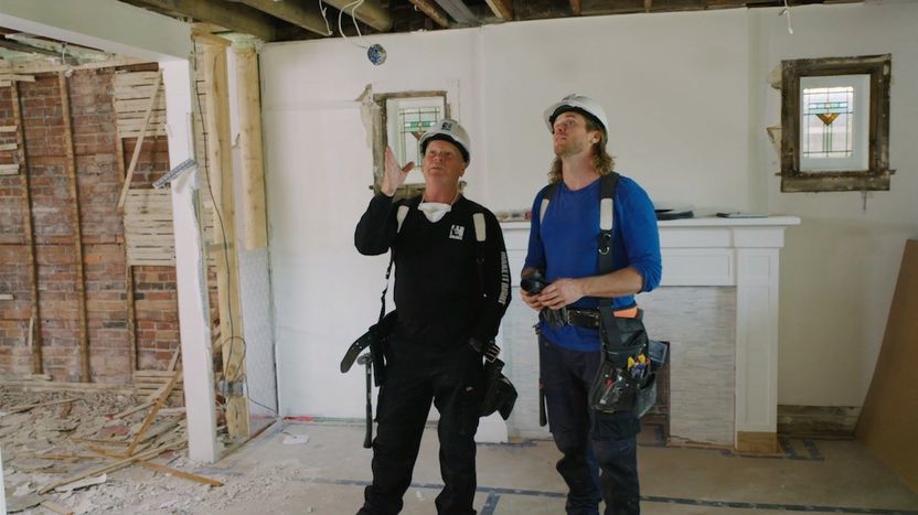 Mike Holmes and Michael Holmes Jr. inspect issues at a job site gone wrong.