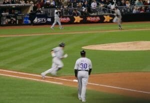 baseball player running to next base at Padres vs Rockies game at Petco Park