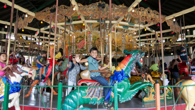 Children riding the Balboa Park Carousel