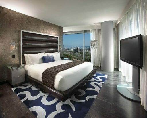 Hotel Room at the San Diego Hard Rock Hotel with a bed, TV and window overlooking downtown