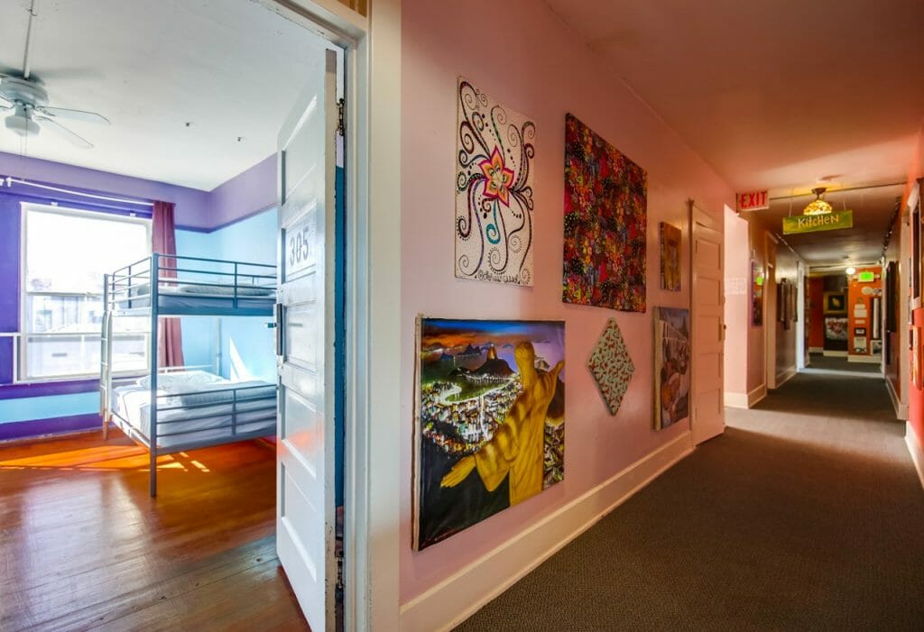 View of hallway and into a dorm room at Lucky D's hostel in San Diego