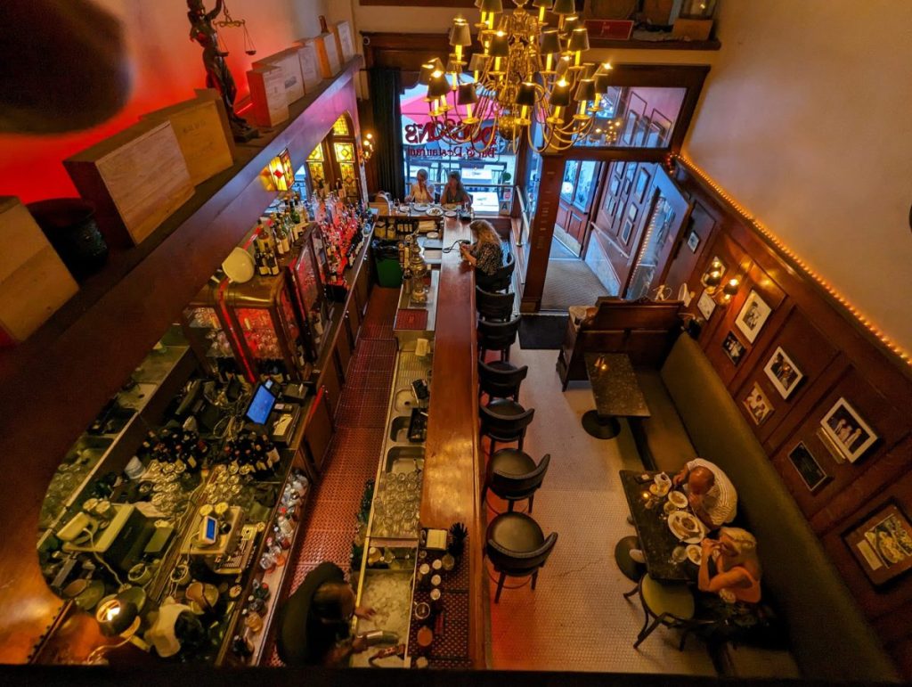 View from Balcony down over bar and tables at Dobson's San Diego