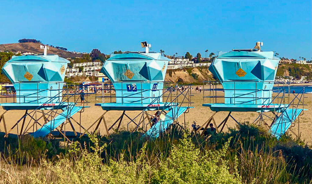 3 turquoise lifeguard towers at Doheny Beach Dana Poing