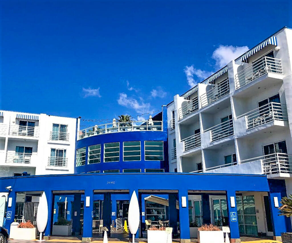 Blue and white building - DoubleTree Suites by Hilton Doheny Beach