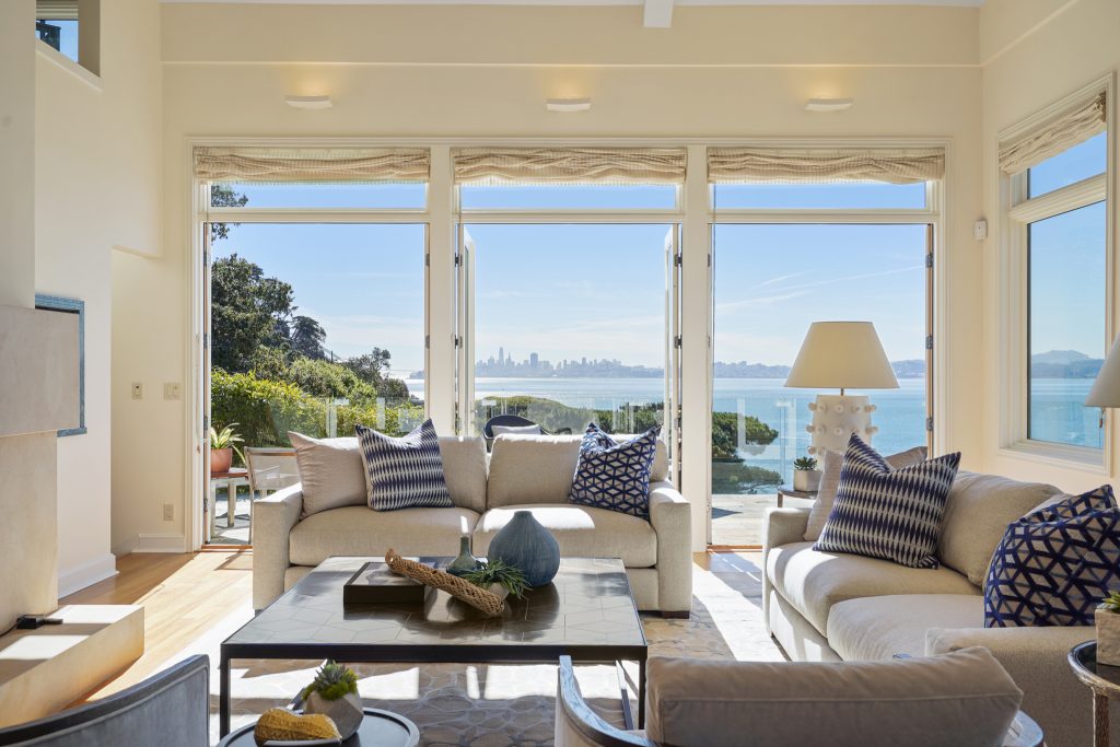 Living room with large windows, natural light, and breathtaking views.