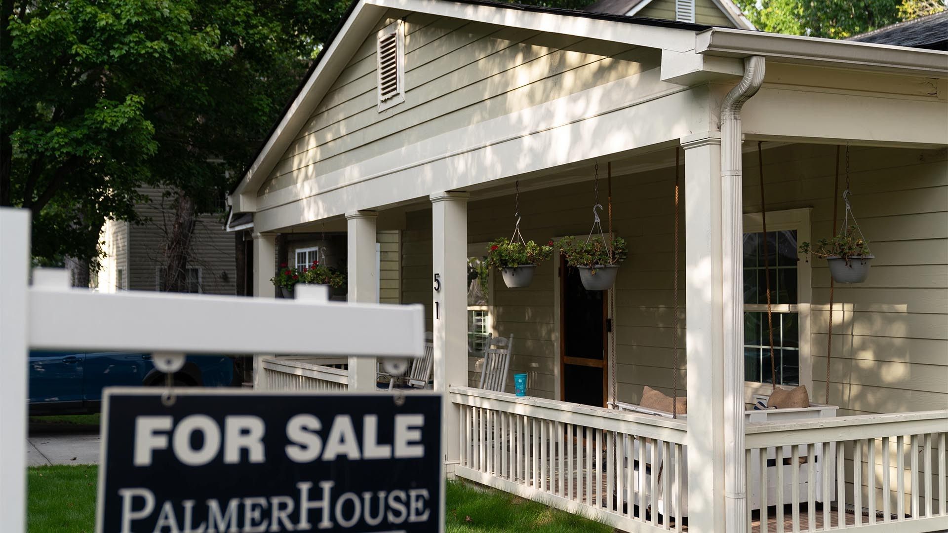 A home with a 'for sale' sign