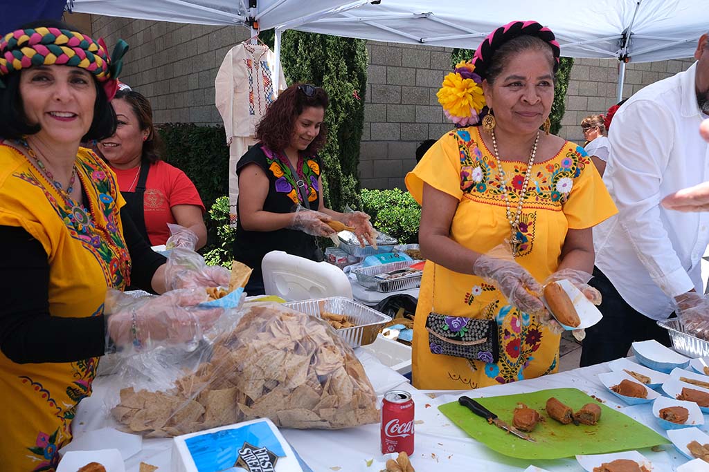 The Hispanic community served free tamales, rolled tacos, guacamole and chips at the festival after the Mass.