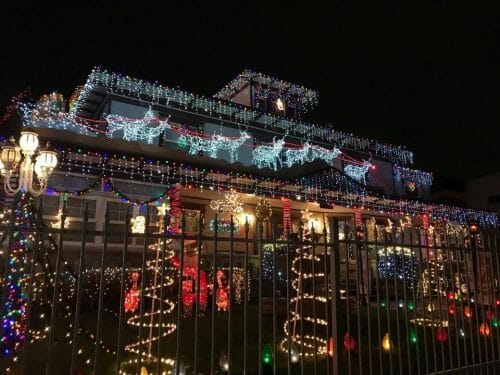 Christmas lights with Reindeer and christmas trees on house in San Diego: Candy Cane Lane Poway