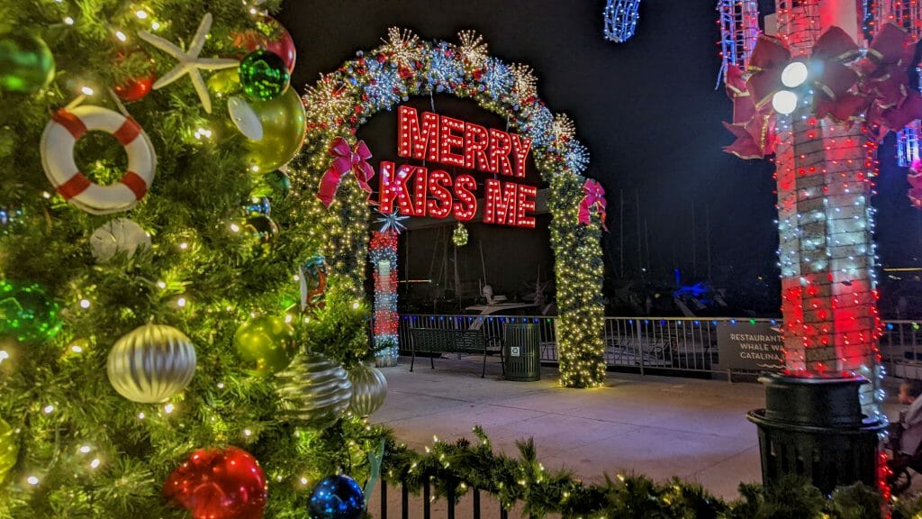 Christmas Light arch with red letters "Merry Kiss Me"