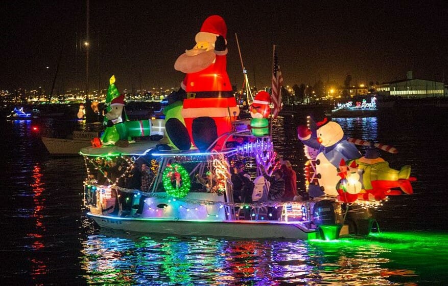 Holiday boat parade in San Diego with boats decorated with Christmas light, Santa Claus and more - Parade of Lights San Diego