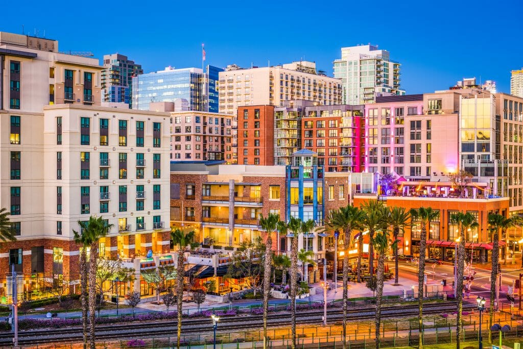 Cityscape of San Diego's Gaslamp Quarter with colorful buildings and palm trees