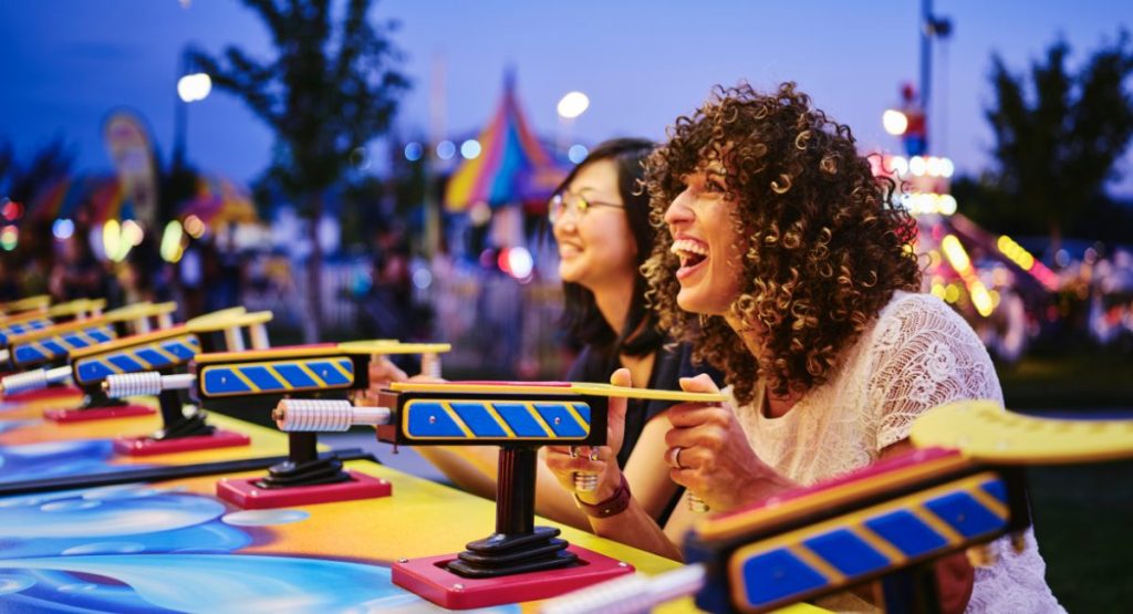 People enjoying carnival games