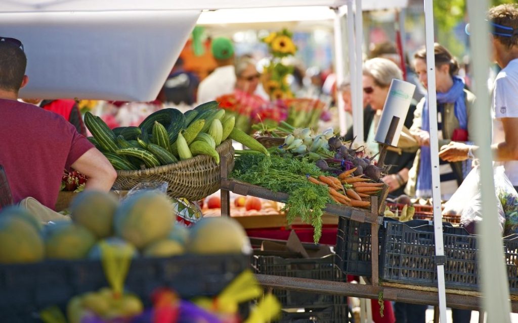 Booth with veggies at farmers market