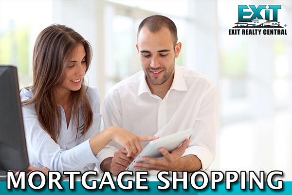 Man and woman holding papers shopping for a mortgage in Coastal Virginia