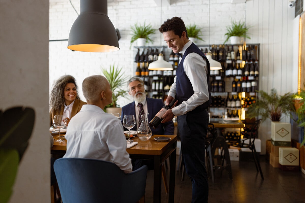 Business people having meeting at Luxury Business Dining restaurant. Vegan food served