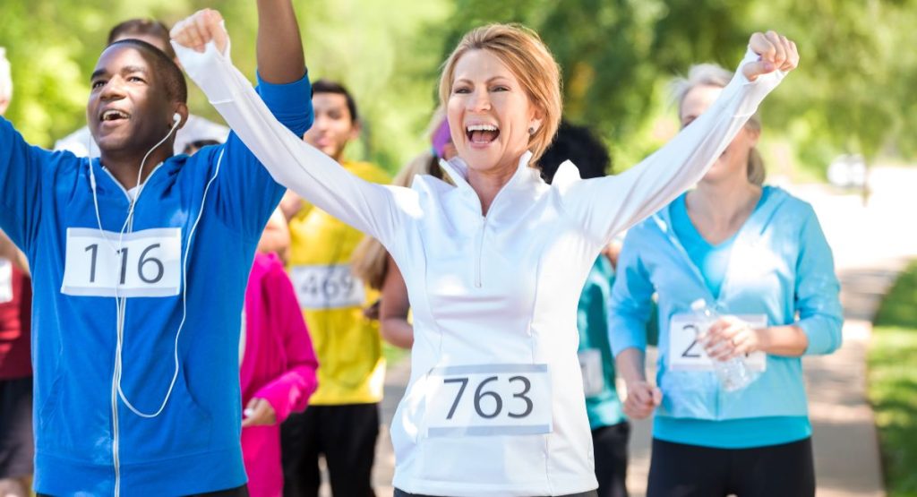 runners celebrating finishing a 5k San Diego