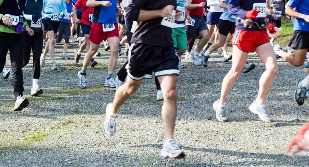 shot of legs of runners at a San Diego 5k race