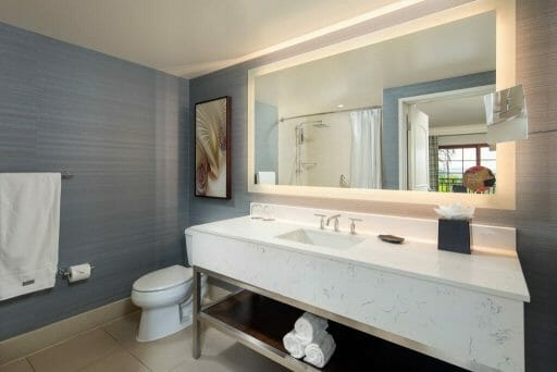 Modern Bathroom at the Westin Carlsbad with large white sink and countertop, a large back-lid mirror