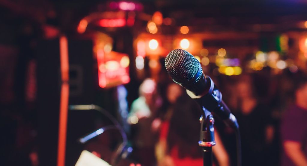 Close up of microphone on stage in bar or restaurant. Karaoke bars in San Diego.