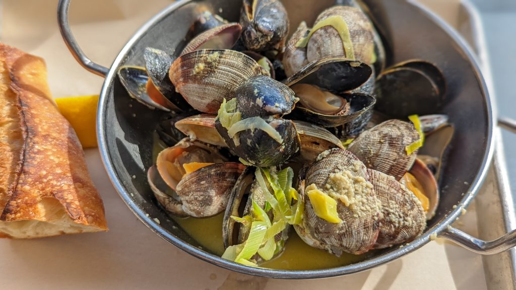 steamed mussels in a metal bowl