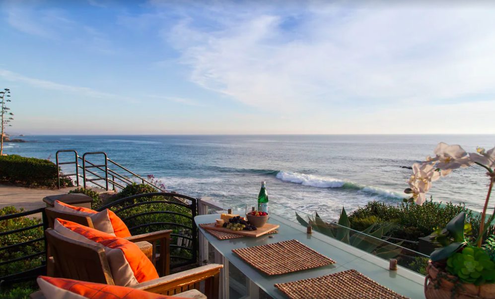 Back patio with outdoor seating overlooking sweeping views of the Pacific Ocean. Luxury Laguna Beach vacation rentals.