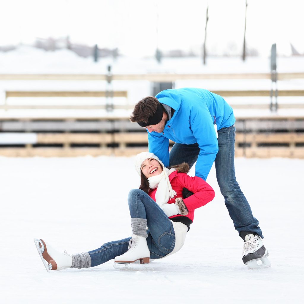 Ice skating couple having fun ice skating